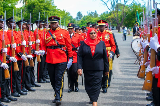 President Suluhu inspects the guard of honour after swearing in (Associated Press)
