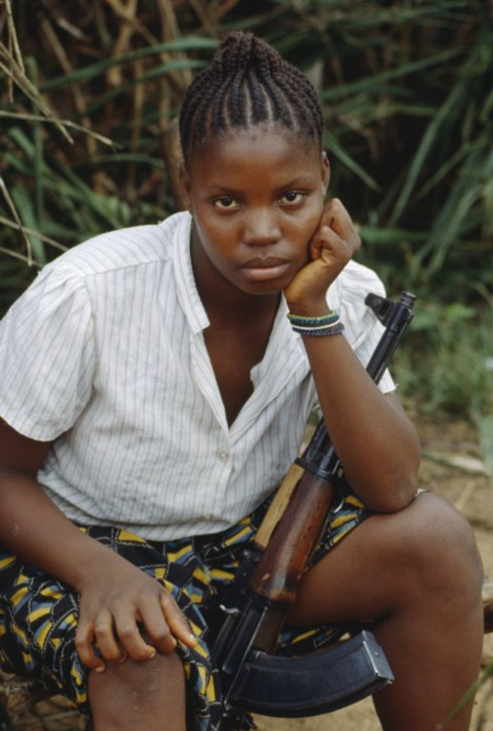 A young female soldier at a training camp in Liberia. Credit: PATRICK ROBERT/SYGMA/GETTY